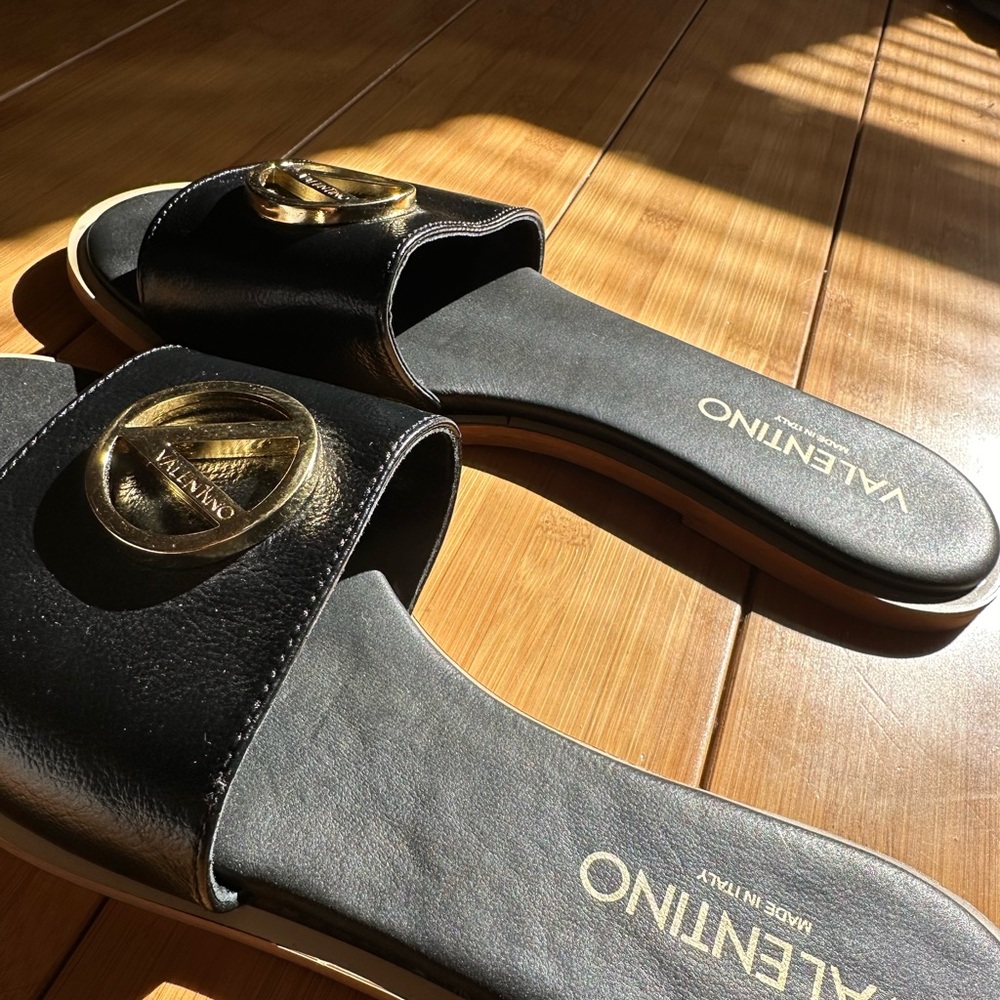 Valentino Black and Gold Slide Sandals with Metallic Logo